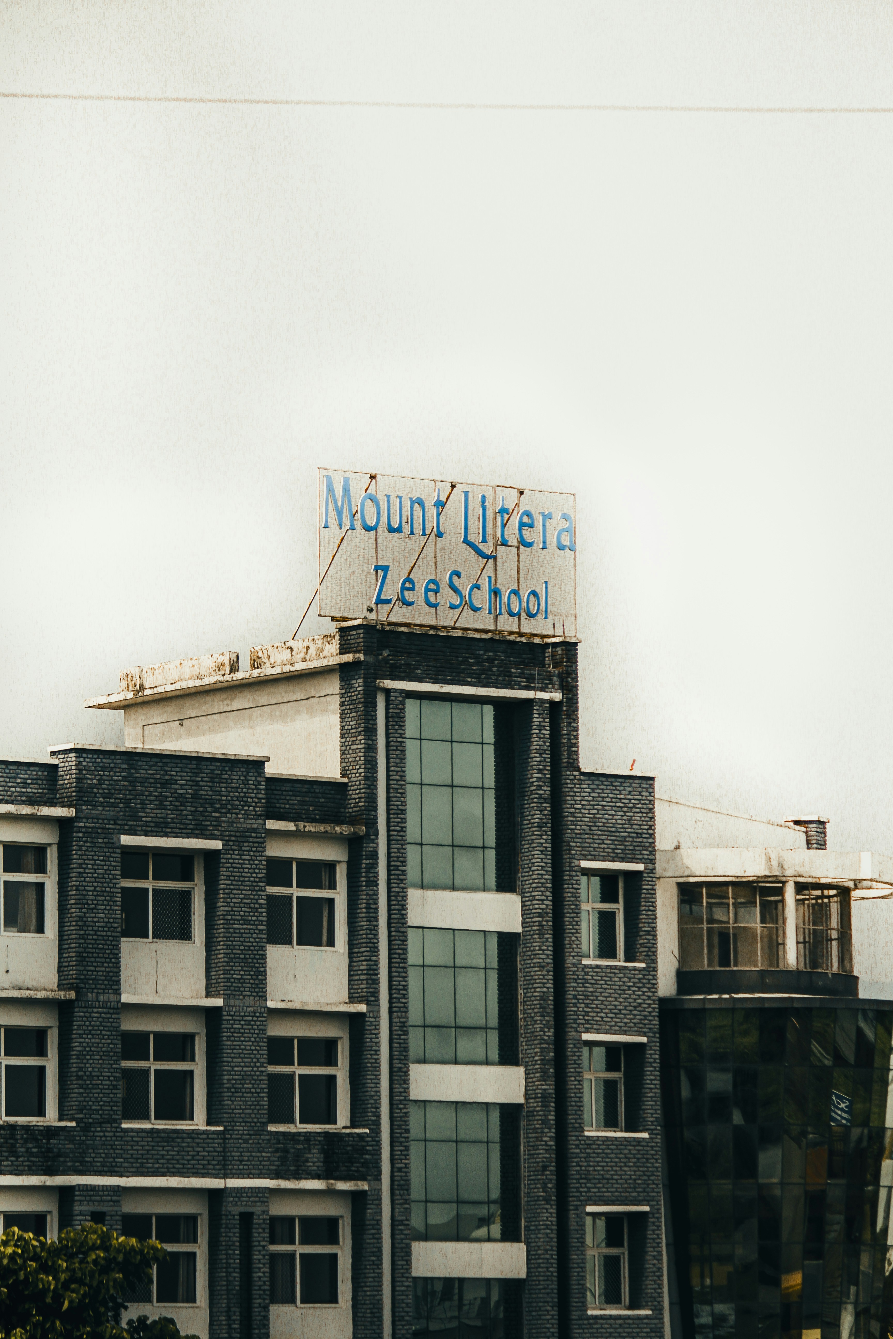 The image shows the building of mount litera zee school.